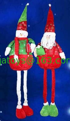 La muñeca y el muñeco de nieve grandes de Papá Noel con el día de fiesta de la Navidad de la pierna de Streaching para celebran el partido